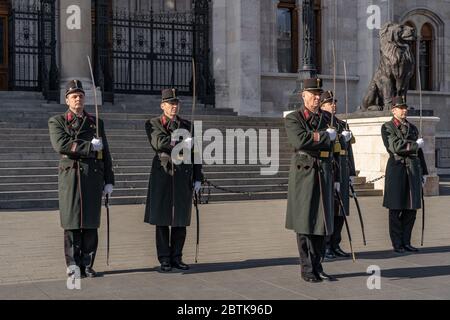 Budapest, Hungary-Feb 8, 2020:Change of guards in uniform with swords in front of Hungarian Parliament in Budapest Stock Photo