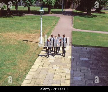 Senior boys walking in grounds of school, Surrey, England, United Kingdom Stock Photo