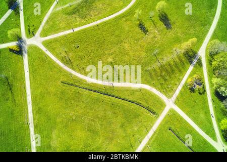Pedestrian and bicycle paths in the green summer park. Top aerial view Stock Photo