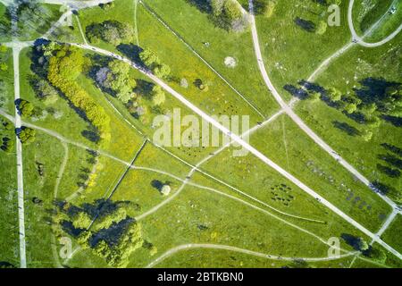 Pedestrian and bicycle paths in the green summer park. Top aerial view Stock Photo
