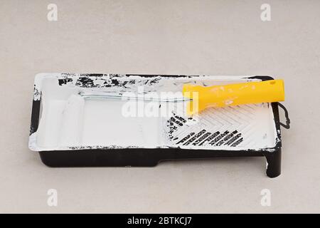 Closeup roller in tray with white pint, nobody Stock Photo