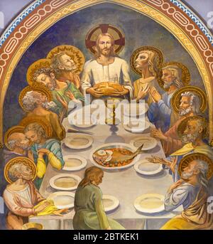 BARCELONA, SPAIN - MARCH 4, 2020: The modern fresco of Last supper in church Iglesia Sant Angel Custodi from unknown artist from year 1936. Stock Photo