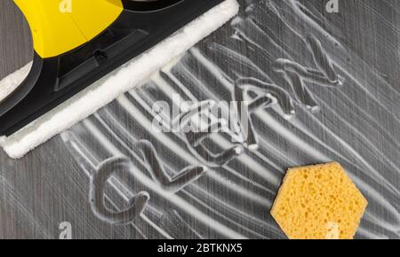 inscription clean on black dirty tile. cleaning and disinfecting tools and equipment.  Stock Photo