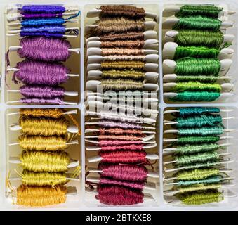 Box of colorful embroidery silks ready for use, organised in a thread storage container Stock Photo