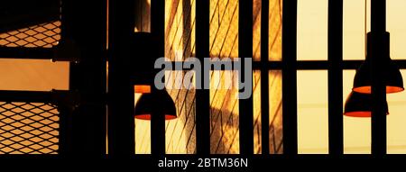 black dark night hanging lamp in the loft industrial room style with orange sun light interior architecture web banner background Stock Photo