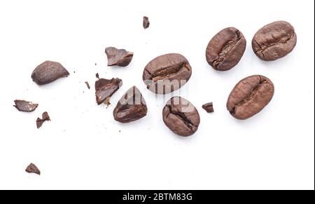 Broken roasted coffee bean with crumbs isolated on white background Stock Photo