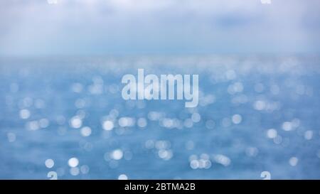 Blurred blue background and blue sky and bokeh sea. Sea in summer sun light Stock Photo