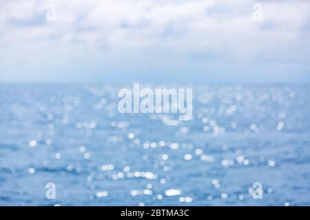 Blurred blue background and blue sky and bokeh sea. Sea in summer sun light Stock Photo