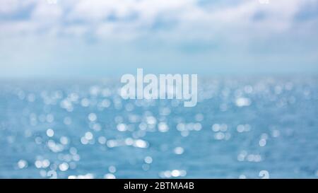 Blurred blue background and blue sky and bokeh sea. Sea in summer sun light Stock Photo