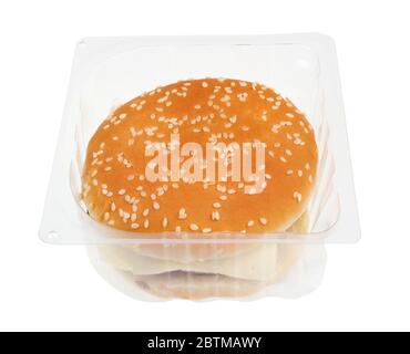 Cheap  tasteless hamburger with cutlet cheese and ketchup  in plastic container box. Isolated pandemic time food Stock Photo