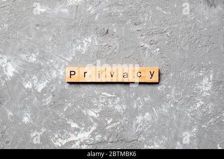 privacy word written on wood block. privacy text on table, concept. Stock Photo