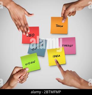 People's hands reaching for notes with various business related words on grey background, collage Stock Photo