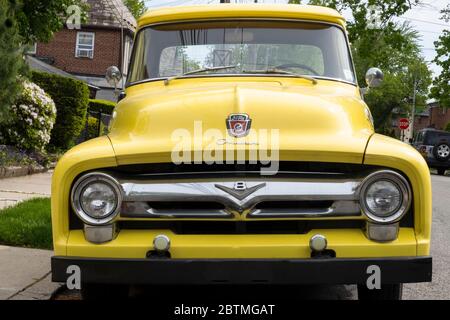 A refurbished 1956 Ford Overdrive pickup truck parked on a quiet residential street in  Queens, New York City. Stock Photo