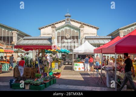 People shopping in summer on the market square in the old town of La Rochelle, France Stock Photo