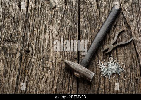 Hammer and Nails Abstract on Wood Background Stock Photo