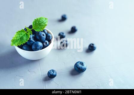 Fresh blueberries in a white bowl. Stock Photo