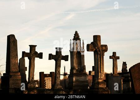 old stone tombs on graves on ancient  cemetery in europe Stock Photo