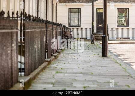 Bicycles leaving against the railings of the period houses of Trinity Church Square in SE1 district of London, England Stock Photo