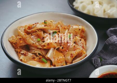 Homemade Rice noodles in chilli oil, selective focus Stock Photo