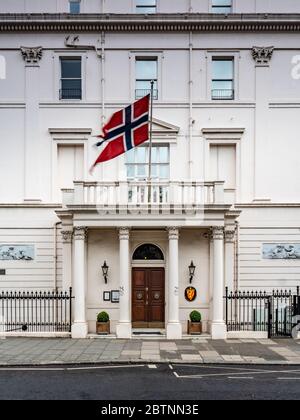 Embassy of Norway, London, UK. The national flag flying over the entrance and façade Norwegian Embassy in London's Belgravia district. Stock Photo