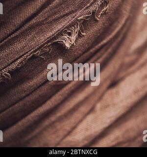 Linen crumpled crease brown background. Close up  Stock Photo