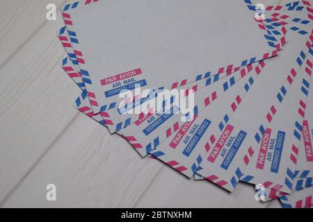 Air Mail Envelope isolated on wooden table. Stock Photo