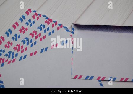 Air Mail Envelope isolated on wooden table. Stock Photo