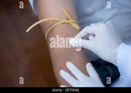 Doctor hand preparing to injecting  patient in the clinic Stock Photo