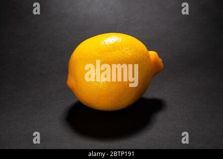 whole lemon on black background Stock Photo