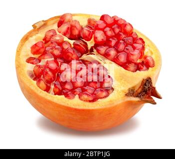 sliced yellow seedless pomegranate path isolated on white Stock Photo