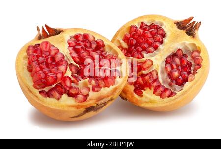 sliced yellow seedless pomegranate path isolated on white Stock Photo