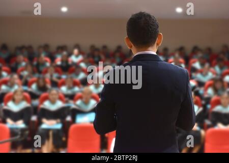 Speak on stage and talk at a meeting . Audience in the meeting room Business and entrepreneurship Stock Photo