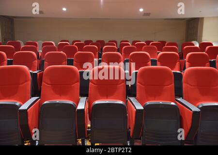 Red chairs in the meeting room Stock Photo