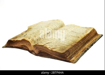 Very old open bible book isolated on white Stock Photo
