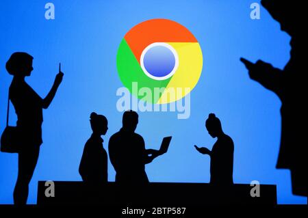 NEW YORK, USA, 25. MAY 2020: Google Chrome web browser developed by Google Group of business people chat on mobile phone and laptop. Company logo on s Stock Photo