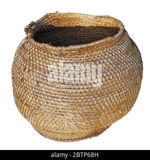 Old vintage homemade basket for vegetables woven from linden bast and willow twigs. Isolated on white Stock Photo