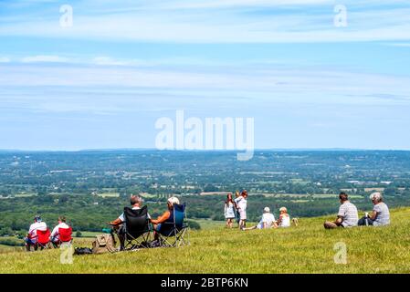 Brighton UK 26th May 2020: Families enjoying the fabulous views over the Sussex Weald at Devil's Dyke in the South Downs National Park in Sussex on a Stock Photo