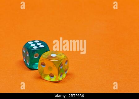 two transparent dice on orange background Stock Photo