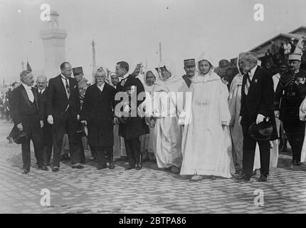 Casablanca welcomes new Sultan . Sidi Mohammed , the young new Sultan of Morocco , accompanied by M Steeg , the French Resident General , making his state entry in Casablanca . 24 December 1927 Stock Photo