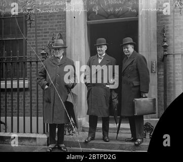 Important cabinet meeting . An important Cabinet Meeting in view of the German Reparations Declaration , took place at No 10 , Downing Street . Lord Sankey , Sir Donald MacLean and Sir John Gilmour , arriving . 11 January 1932 Stock Photo