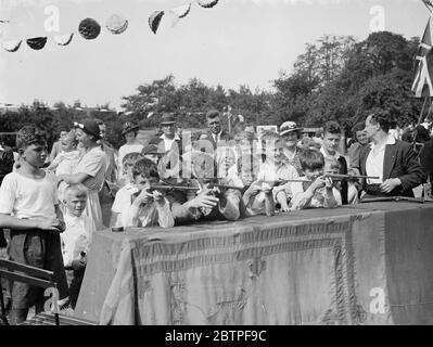 Eltham Roman catholic fete . Boys show their shooting ability on the air rifle range . 1938 Stock Photo