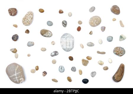 Mix of rounded multicolor textured stones. Isolated on white background flat lay Stock Photo
