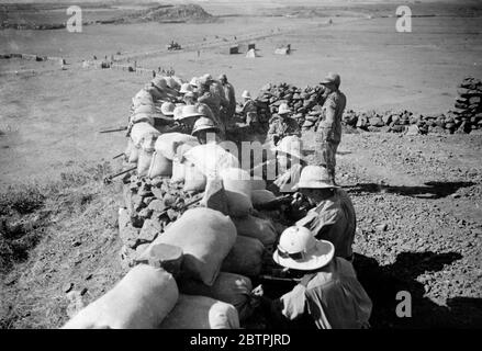 Sandbag defences at Adigrat . Troops , protected by sandbags , guarding the new Italian road seen stretching across the desert at Adigrat , where elaborate defences have been constructed in the consolidation of the northern line . 25 October 1935 Stock Photo