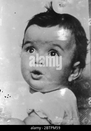 Wondering girl ! New picture of Dempsey ' s baby daughter . The latest picture of Joan Dempsey , daughter of the ex world champion heavyweight , Jack Dempsey . Joan , how 18 months old , weighs 30 pounds . Her mother mother is the former Hannah Williams . 2 March 1936 Stock Photo