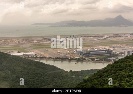 Hong Kong / China - July 24, 2015: Aerial view of Hong Kong International Airport (Check Lap Kok International Airport), an important regional passeng Stock Photo