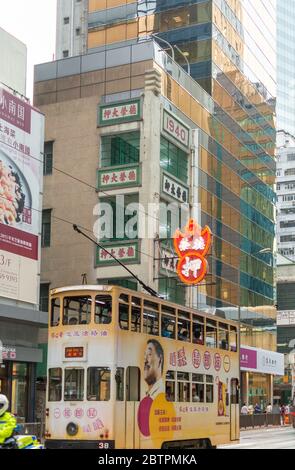 Hong Kong / China - July 23, 2015: Iconic Hong Kong double-decker tram in downtown Hong Kong Stock Photo