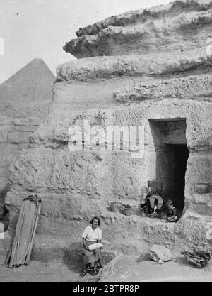 5000-year-old tomb called home. A 5000 year old tomb within sight of the pyramids of Egypt, believed to have been the burial place of King Khafra, has been made into a temporary home by Mrs Dorothy Meguid, librarian of the University of Cairo's Archaeological Expedition, which is now excavating near the pyramids. The tomb is carved out of solid rock, Photo shows, Mrs Meguid , and her four-year-old daughter, Seti, at the door of their 5000-year-old home in the tomb. Stock Photo