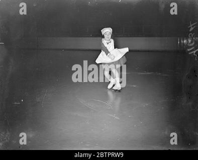 'Nurse'on the ice. Five-year-old won the skater, Beryl Bailey, is practising in her nurse's uniform at the Harringay arena, for her part in the Ice Carnival, which takes place next week in aid of the Royal Hospital, Richmond. 12 November 1937 Stock Photo