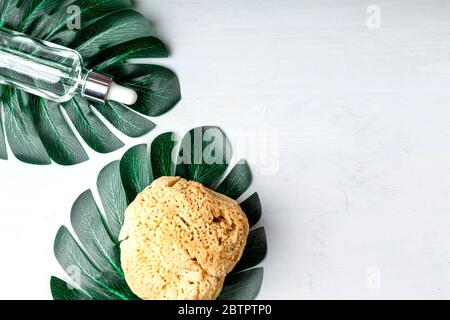 Stylish composition of accessories and cosmetics from ecological materials for bath procedures on light wood background. Flat Lay Style. Stock Photo