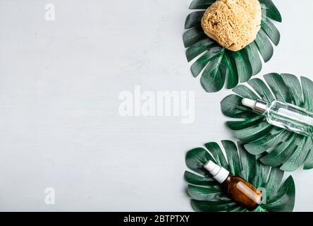 Stylish composition of accessories and cosmetics from ecological materials for bath procedures on light wood background. Flat Lay Style. Stock Photo